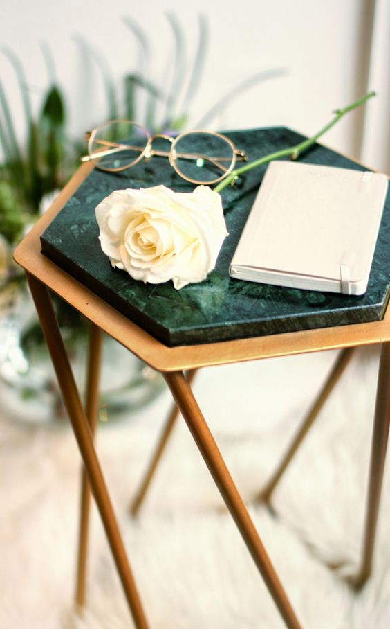 a geometric brass side table with a green marble top looks just wow and makes a refined statement