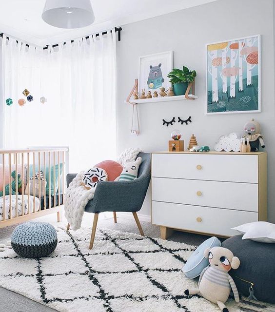 the space made more eye-catchy with bold artworks, a printed rug and some muted colored touches