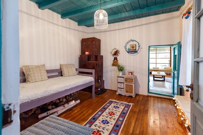 Here's one more bedroom with a vintage hearth in the corner and a traditional bench with firewood under it Here's one more bedroom with a vintage hearth in the corner and a traditional bench with firewood under it