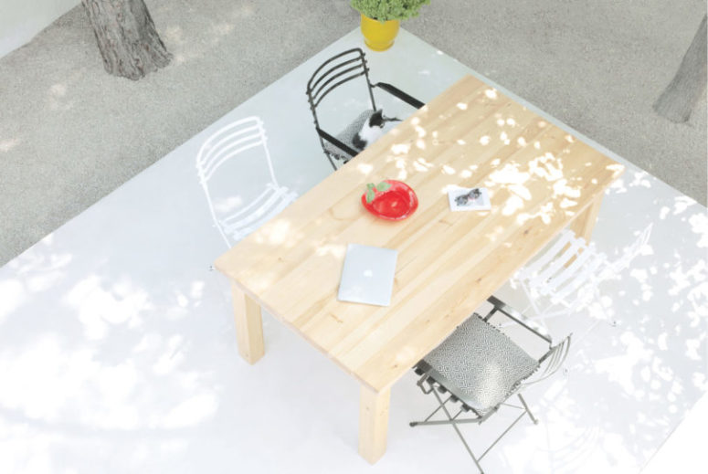 The outdoor terrace features a dining zone with different chairs