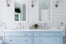 09 a serenity blue vanity adds a coastal feel to the bathroom and when you are tired of it, you can just repaint it