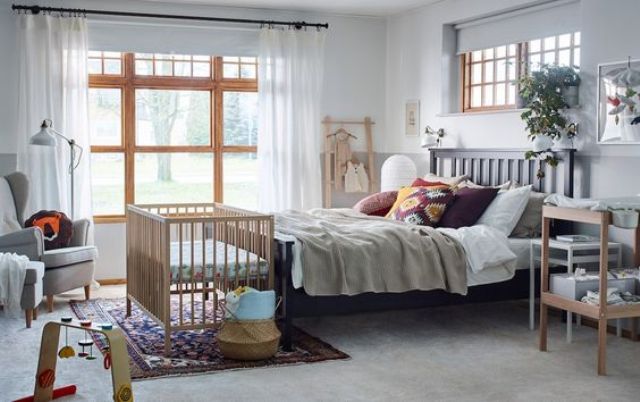 master bedroom with baby crib