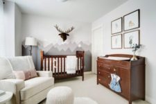 a mountain statement wall, a faux moose head add interest to a neutral and peaceful space