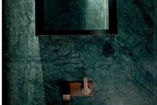 11 a green marble bathroom wall with a matching sink, a laconic square mirror for a natural yet refined feel