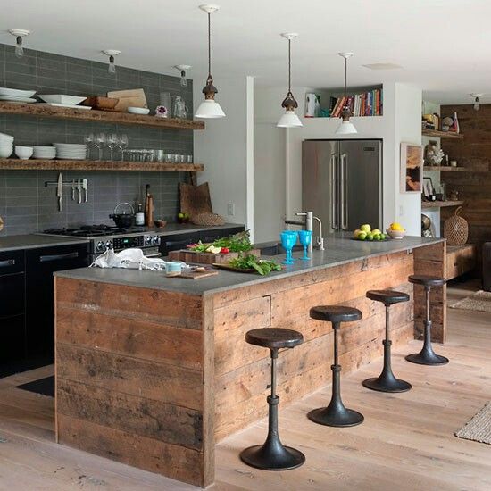 a masculine-looking kitchen island with wraparound reclaimed wood and a metal countertop for an amazing look and metal stools to pair