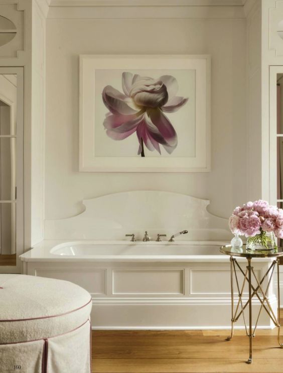 a refined cutout bathtub backsplash done of white acryl makes the space amazing