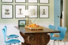 12 an antique table with carved legs and bold blue chairs on metal legs that highlight it