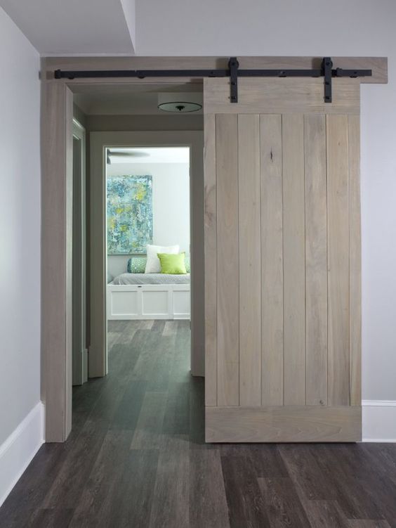 a neutral barn sliding door is a great addition to the interior and it doesn't look too rustic