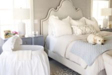 16 a preppy bedroom with a vintage feel and a fabric covered crib by the bed