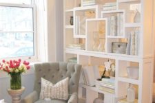 17 a little girlish home office nook is separated from the rest of the space with an elegant white shelving unit