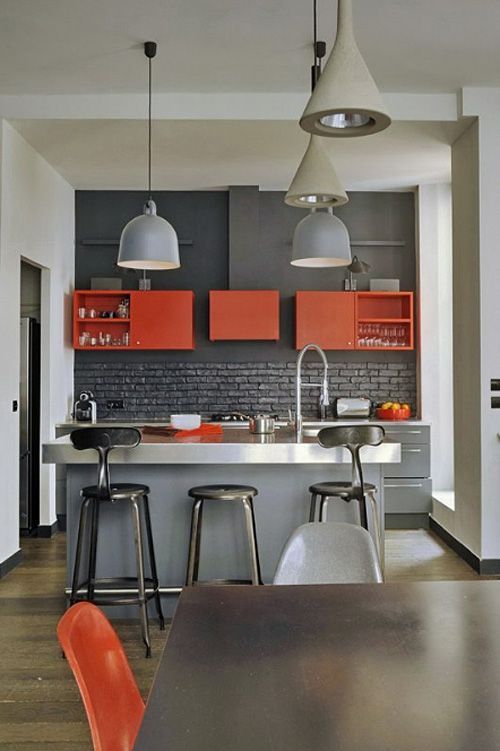 a small kitchen island of grey plywood and a metal countertop can be used as a breakfast nook