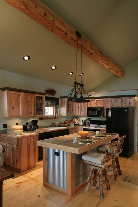 a unique piece of corrugated metal and light-colored wood with a dining space for a rustic meets industrial kitchen
