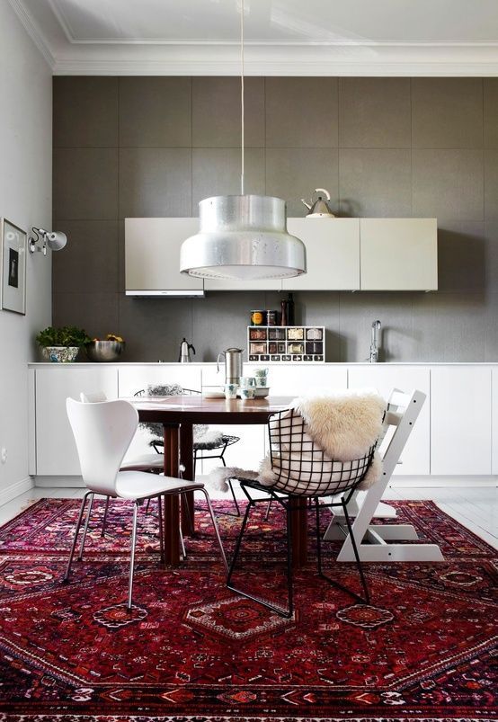 a vintage wooden table and totally mismatched chairs - metal and wooden ones of different colors