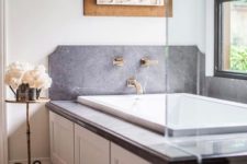 20 grey marble and gilded faucets make this bathtub space very sophisticated and personalized