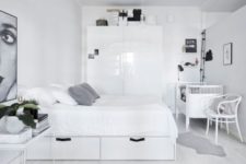 21 a monochrome Scnadinavian bedroom with minimalist furniture and a crib in the corner, a chair and lights are a must there