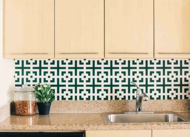 highlight your kitchen style and colors with a bold geometric wallpaper backsplash liek this one