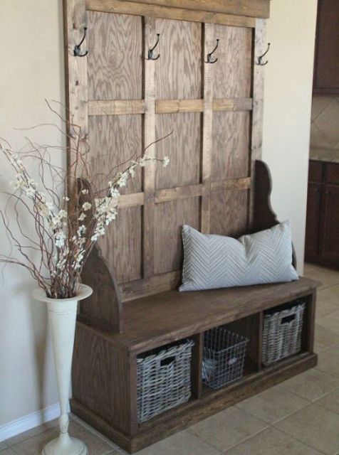 a hall tree bench with hooks and storage compartments with metal and woven baskets