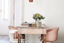 22 a vintage rustic table and white and blush modern chairs that match in colors