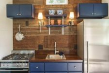 22 even a small nook can get some color with bold cabinets like these blue ones, for example