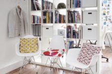 23 IKEA Kallax shelving unit hides a home office nook from the entryway and boxes inserted bring more privacy