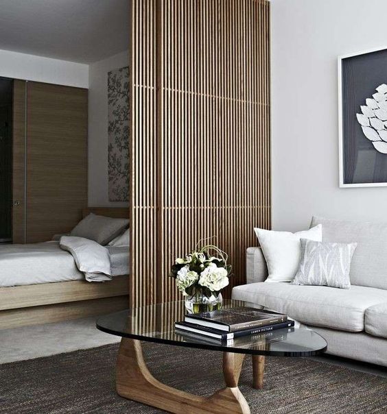 a very sleek bamboo screen is in absolute harmony with the minimalist aesthetics of this space