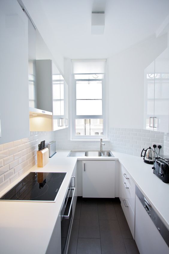 an all-white look is an amazing idea, and here a faux brick backsplash adds interest