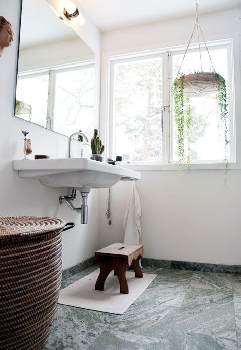 green marble tiles on the floor to make a colorful statement and add a refined touch to the space