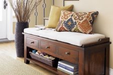 26 a wooden bench with a cushion, drawers and an open shelf for storage for a rustic space