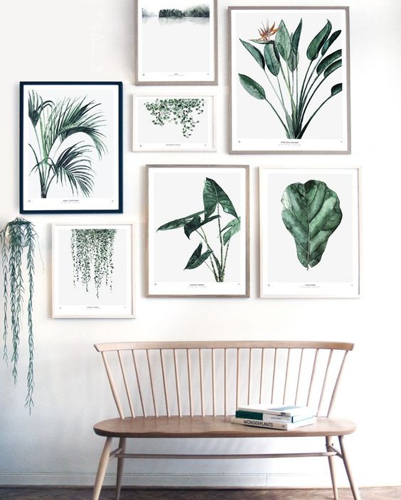 an ethereal wooden bench and a gallery wall with mismatched frames and botanical pics for a natural feel
