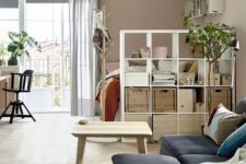 26 use IKEA Kallax unit to make your sleeping space in a studio more private and comfortable