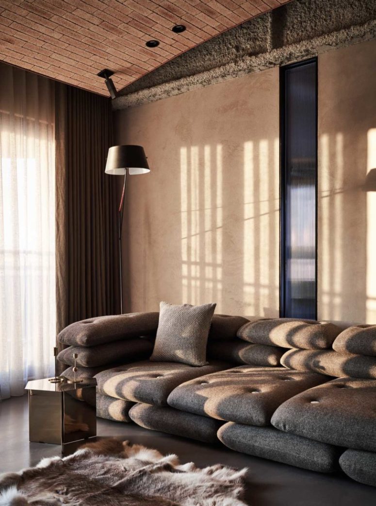 The living room is done with a unique sofa, all made of cushions and pillows and I like the glam touches here kept in earthy colors The living room is done with a unique sofa, all made of cushions and pillows and I like the glam touches here kept in earthy colors