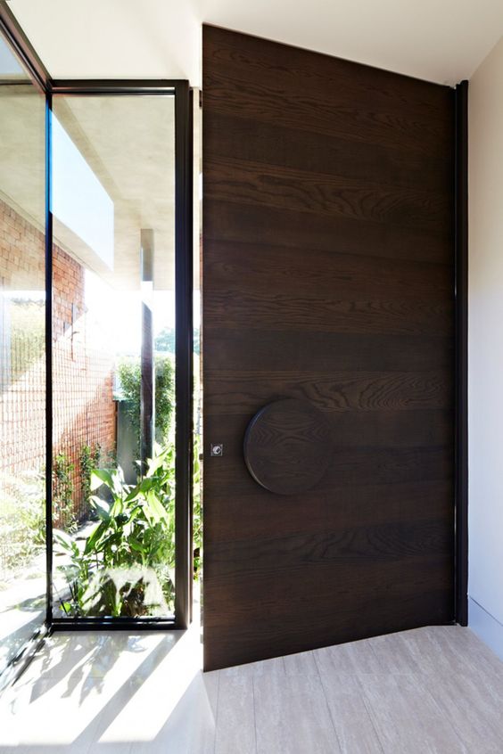 a gorgeous dark stained front door will make a stylish statement at once