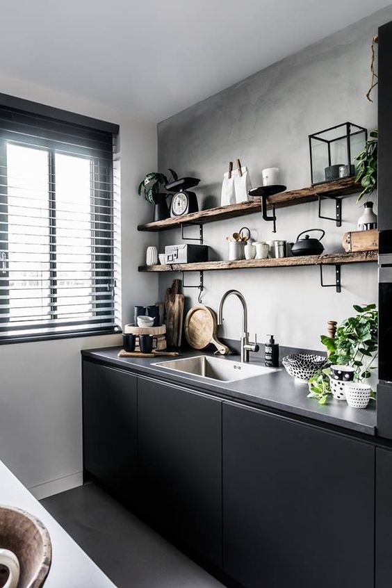 a grey concrete backsplash and countertop plus raw edge wooden shelving add texture here