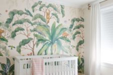 03 a peaceful tropical space with an eye-catchy wallpaper wall, a pink chandelier, a faux fur rug