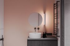 03 a pink painted statement wall to add a splash of color to a minimalist bathroom