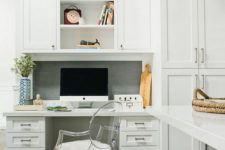 03 a seamlessly built-in office nook in the kitchen, the desk and cabinets made in the same style and look as the kitchen itself