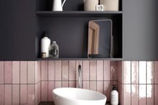 04 a combo of glossy pink long narrow tiles and a matte black cabinet over them for a chic modern look