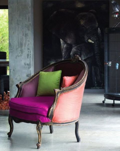 a vintage-styled chair with neon upholstery in fuchsia, peachy pink and purple to create a contrasting look