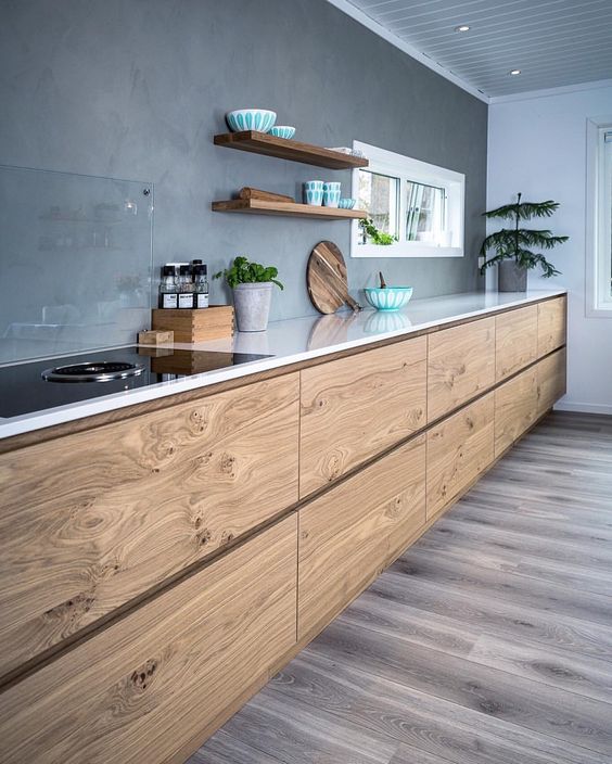 to highlight the modern kitchen look go for a concrete backsplash and add a glass screen where needed