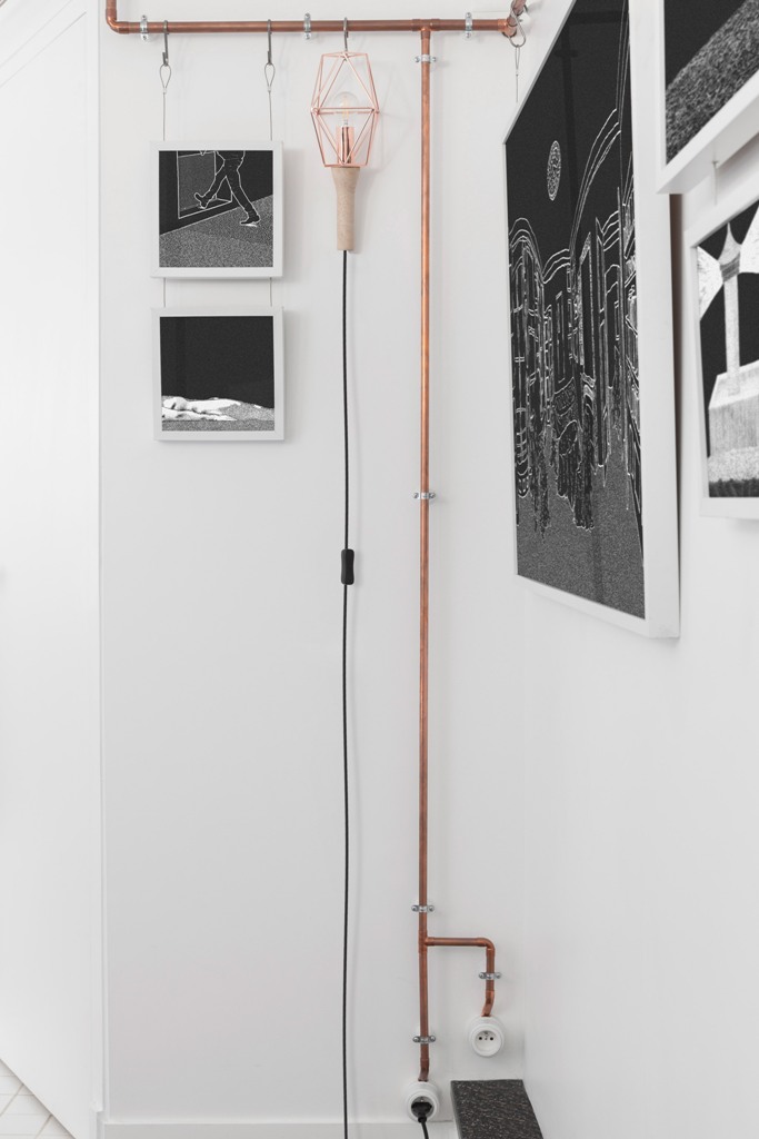 industrial space There are some other industrial touches in the space like these industrial lamps of copper and cord