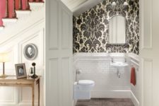 06 a powder room styled with white tiles and vintage printed wallpaper for a vintage feel