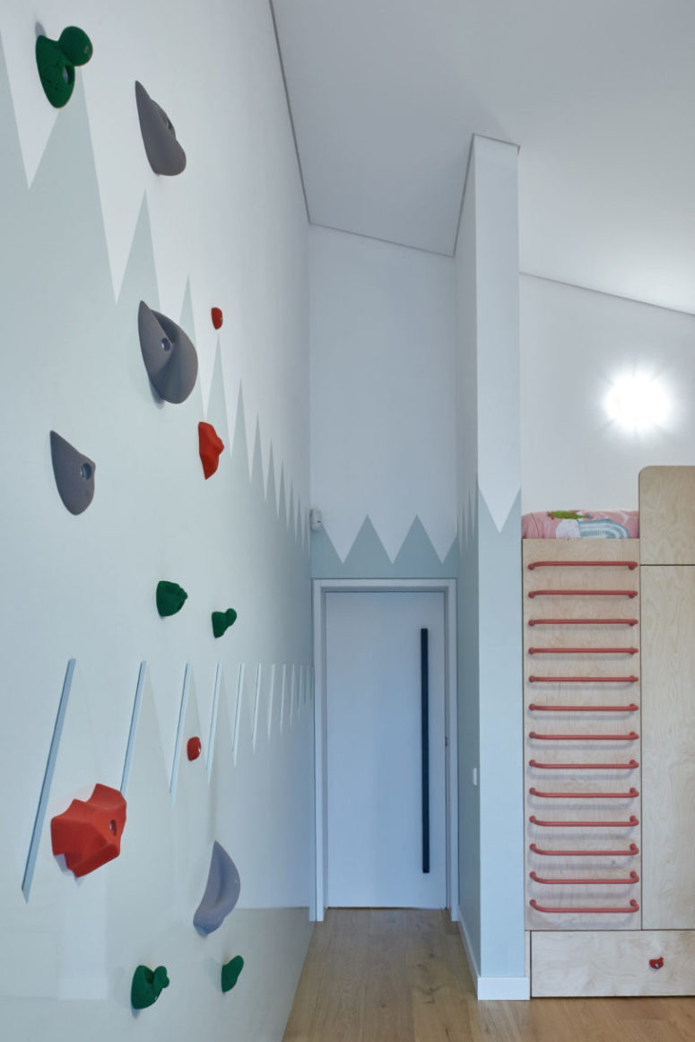 The kid's room is done with a large piece, which includes storage and a bed on top, there's a real climbing wall The kid's room is done with a large piece, which includes storage and a bed on top, there's a real climbing wall