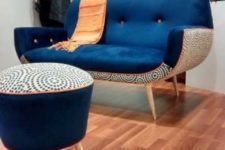 07 a chic and bold mid-century modern chair with a navy top and a printed base and a matching footrest