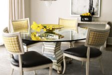 08 a chic dining space with creative chairs with black leather seats and yellow print backs with a nail trim