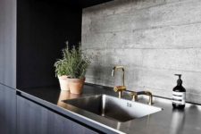 08 dark wooden cabinets, stained steel countertops and a textural concrete backsplash for a stylish moody look