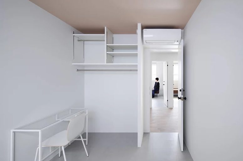 home office with open storage system Here's one more working space done in all-white, with white furniture and an open storage unit