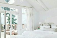13 a glazed wall and a a round window over it help to make the room airier and fresher