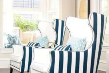 15 spruce up your vacation home with such creative wingback chairs with a white top and striped backs with a nail trim