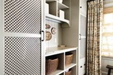 17 a traditional laundry with a washer and dryer behind lattice doors makes using them easy and you avoid the clutter