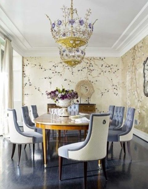 elegant blue and cream chairs on dark stained wood legs complete the polished style of the dining room